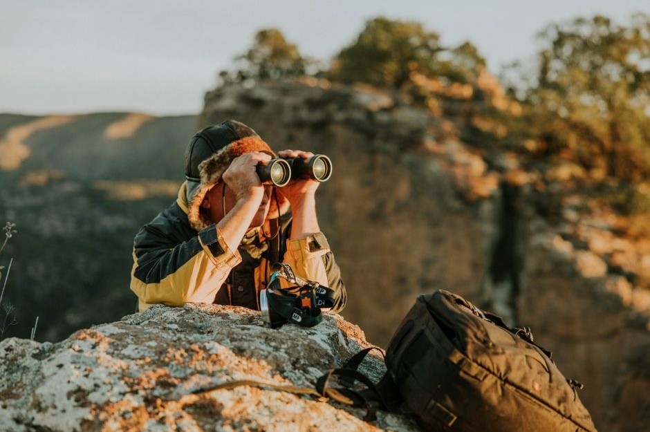 A photographer using a camera during an outdoor walk